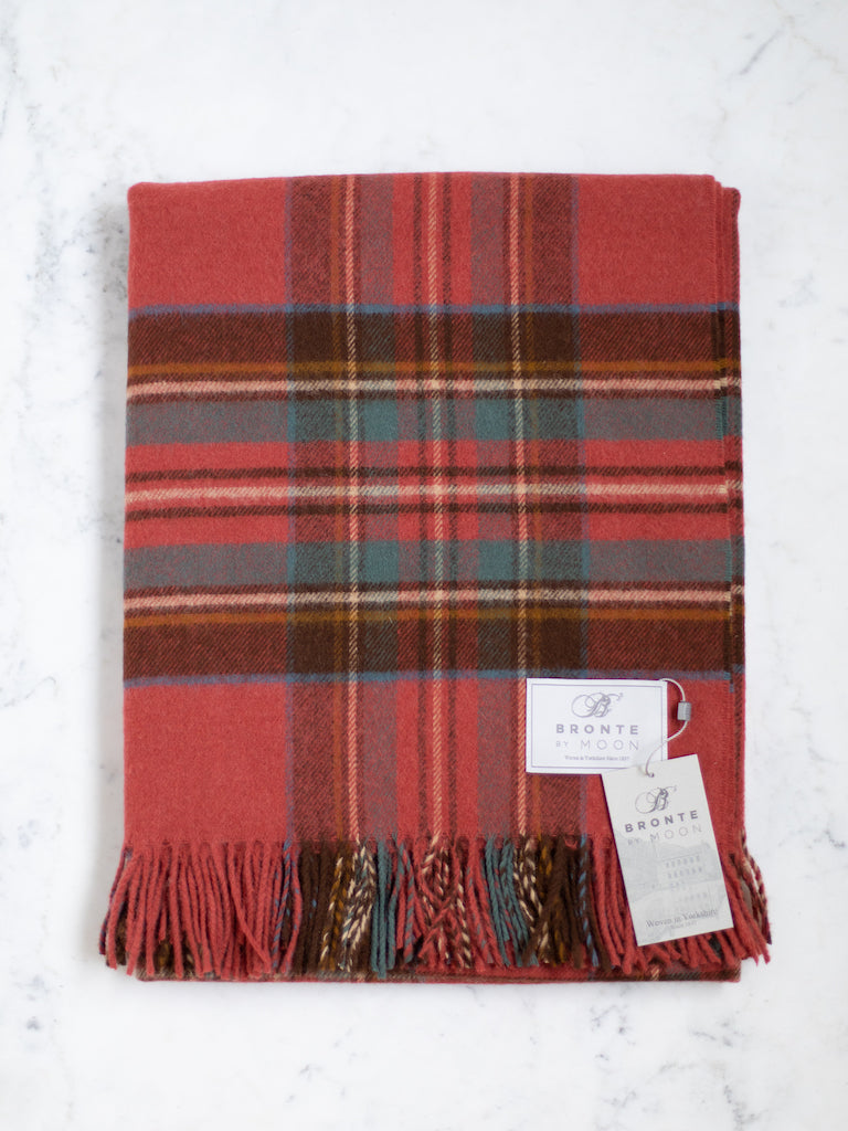 Antique Royal Stewart throw, a red base color with a thick black, white, yellow, and blue plaid pattern.