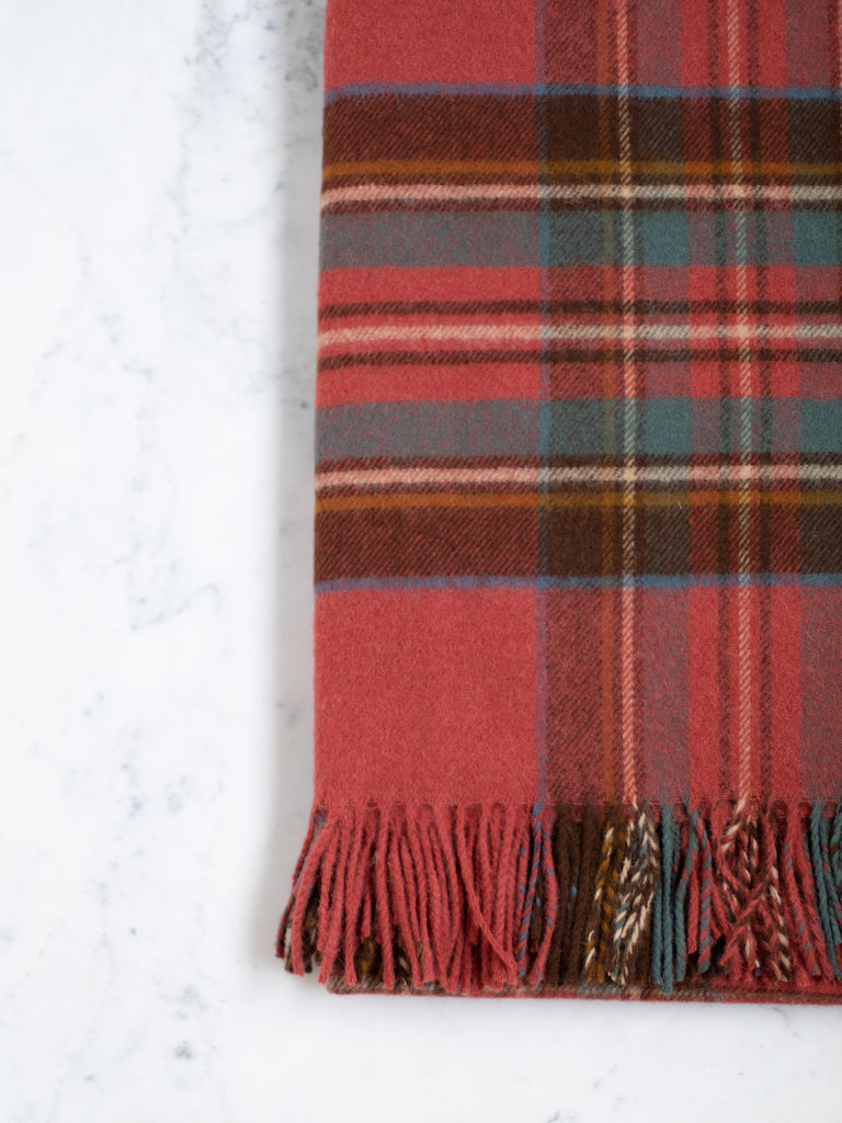 Antique Royal Stewart throw, a red base color with a thick black, white, yellow, and blue plaid pattern.