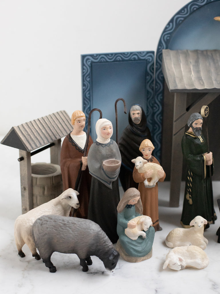 Townspeople and shepherd figurines along with various animals.