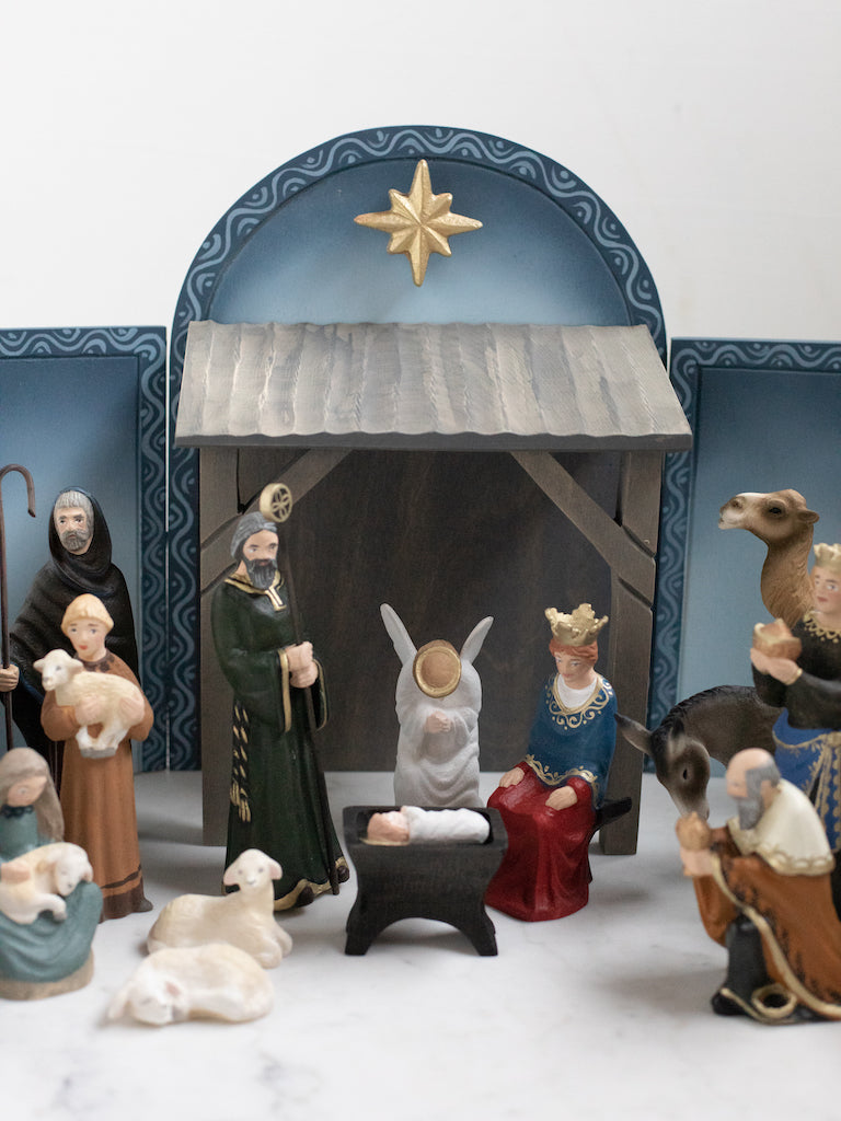 Mary, Joseph, and baby Jesus figurines accompanied by other characters.