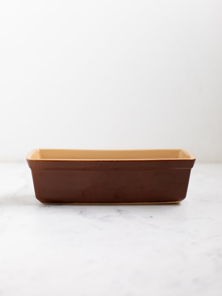 Dark brown bread pan. 