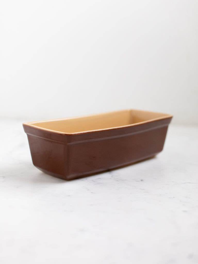 Dark brown bread pan. 