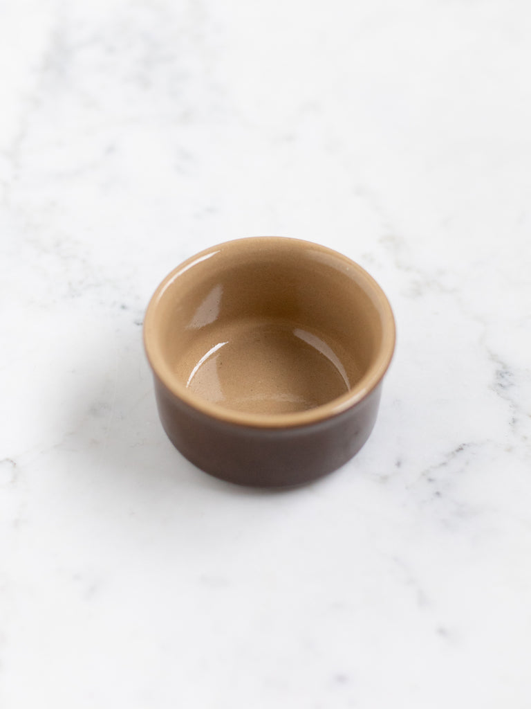 Dark brown bowl dish from the top showing light brown interior. 