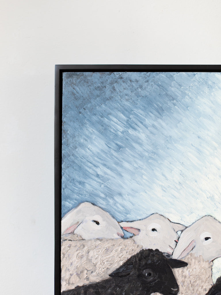 A large painting of Mary, Joseph, and baby Jesus, surrounded by different types of sheep and a small white donkey, all sitting outside with the bed made of hay in front of them.