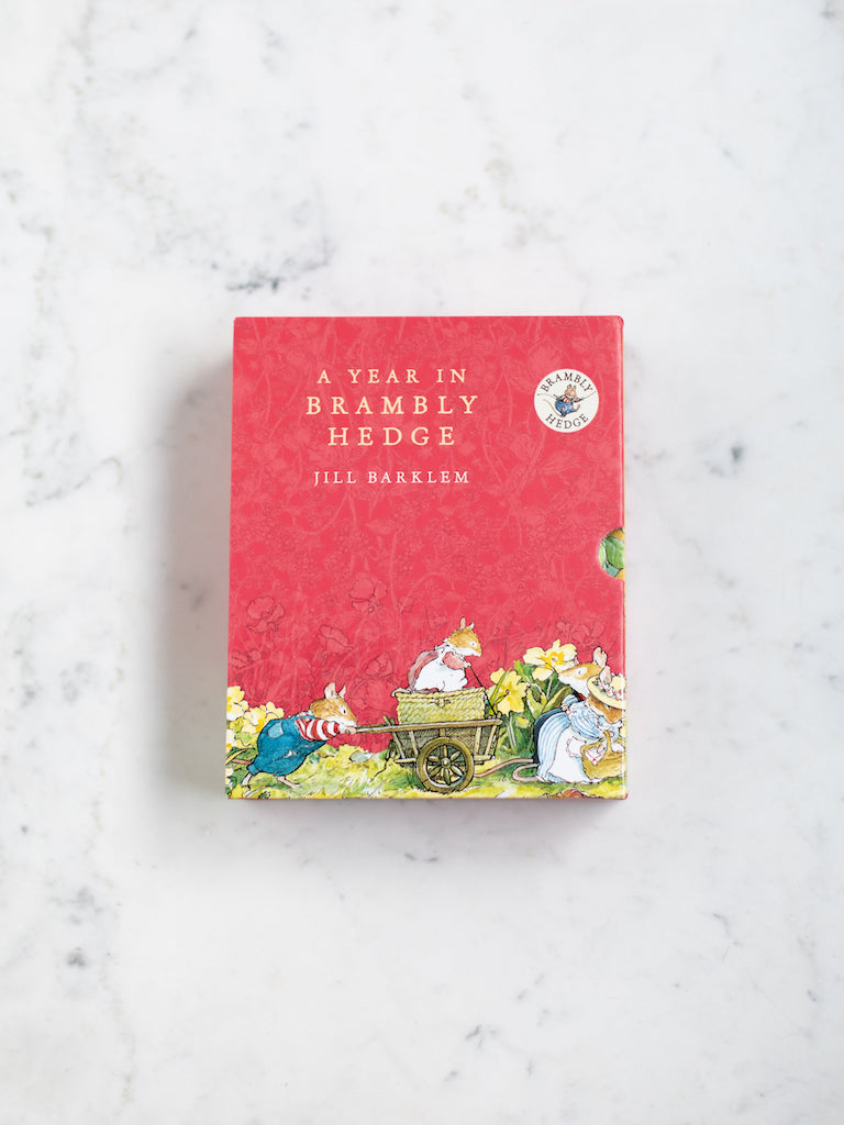 A Year in Brambly Hedge package box cover, red with small art of different story characters.