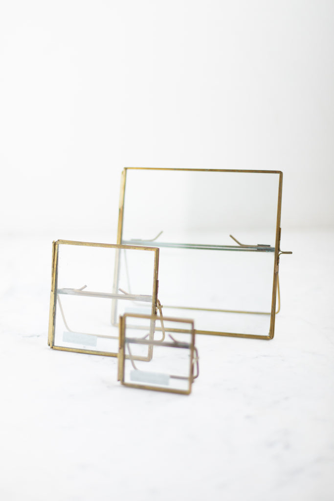Brass easel frames, vintage style with clear class front and back.