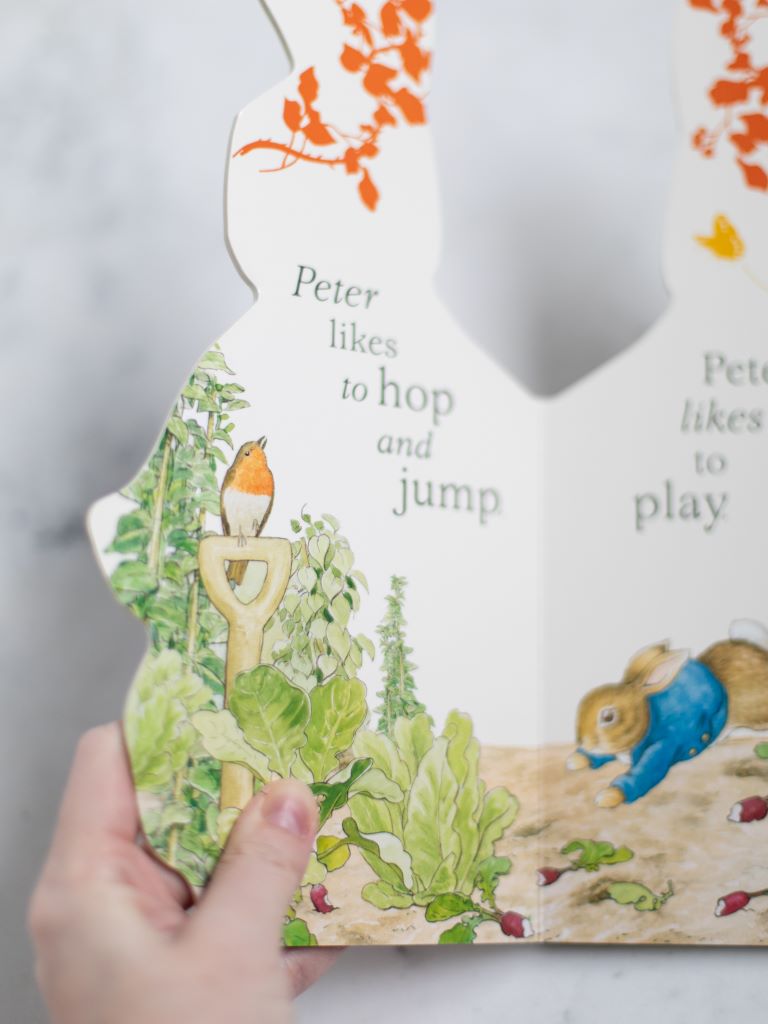 Sample page with large green text that says “Peter likes to hop and jump” with a bird perched on the side of Peter.