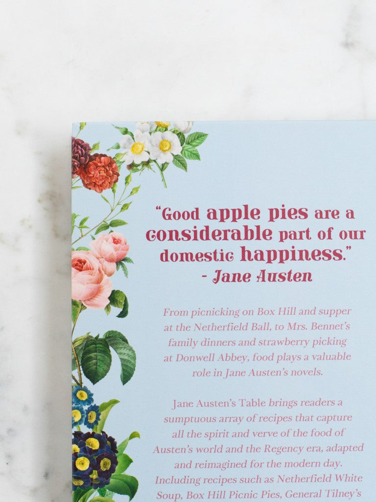 The back of a cookbook with a quote from Jane Austen saying “Good apple pies are a considerable part of our domestic happiness.” 
