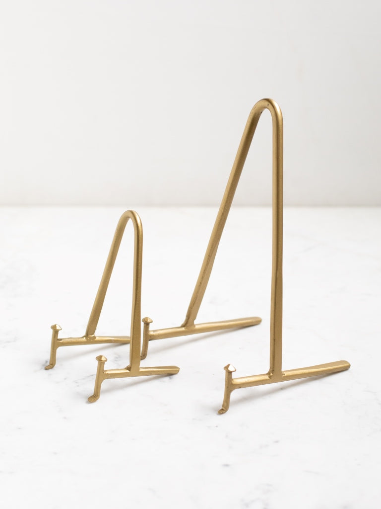 Side view of the small and medium brass displays side by side.