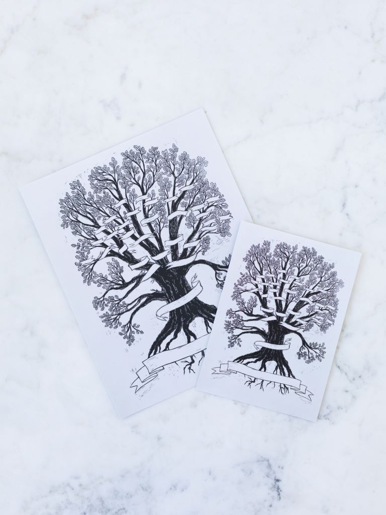 A small and a large print of a tree with a banner wrapped around it where you can place your own names on the branches. 
