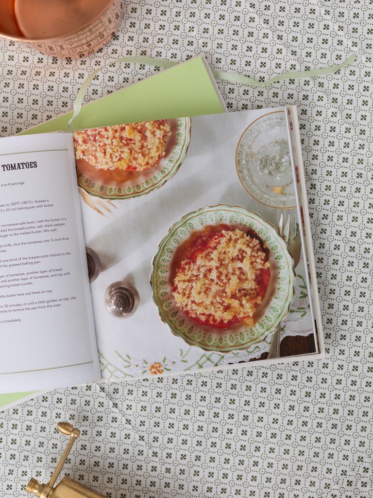 Sample page of the cookbook with plated tomato dish.