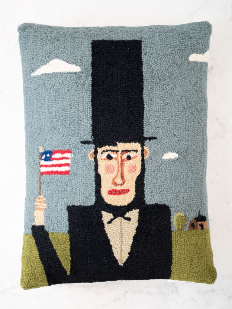 Throw pillow with Abe Lincoln on the front.