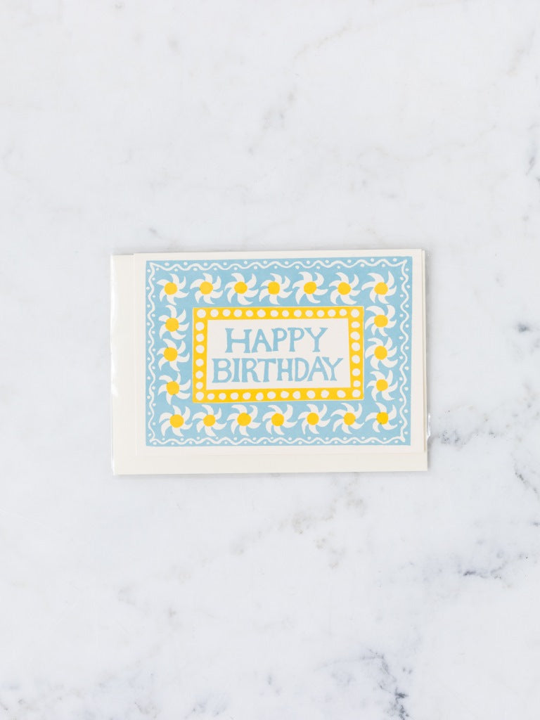 Light blue and yellow patterned happy birthday card.