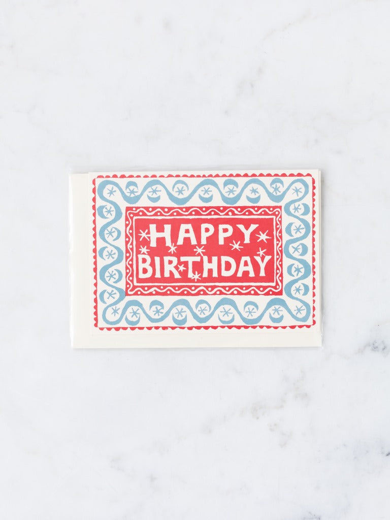 Teal and red patterned happy birthday card.