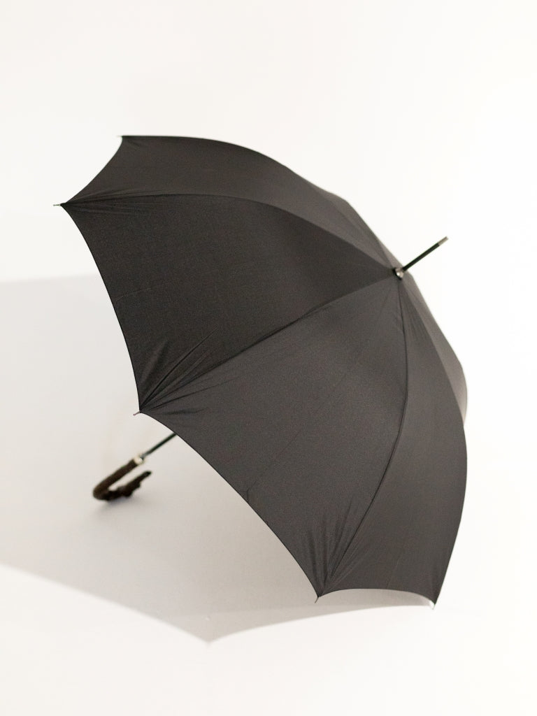 The top of an open black umbrella.