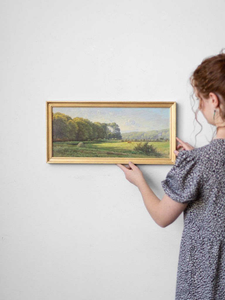 Person hanging Danish Pastoral up.