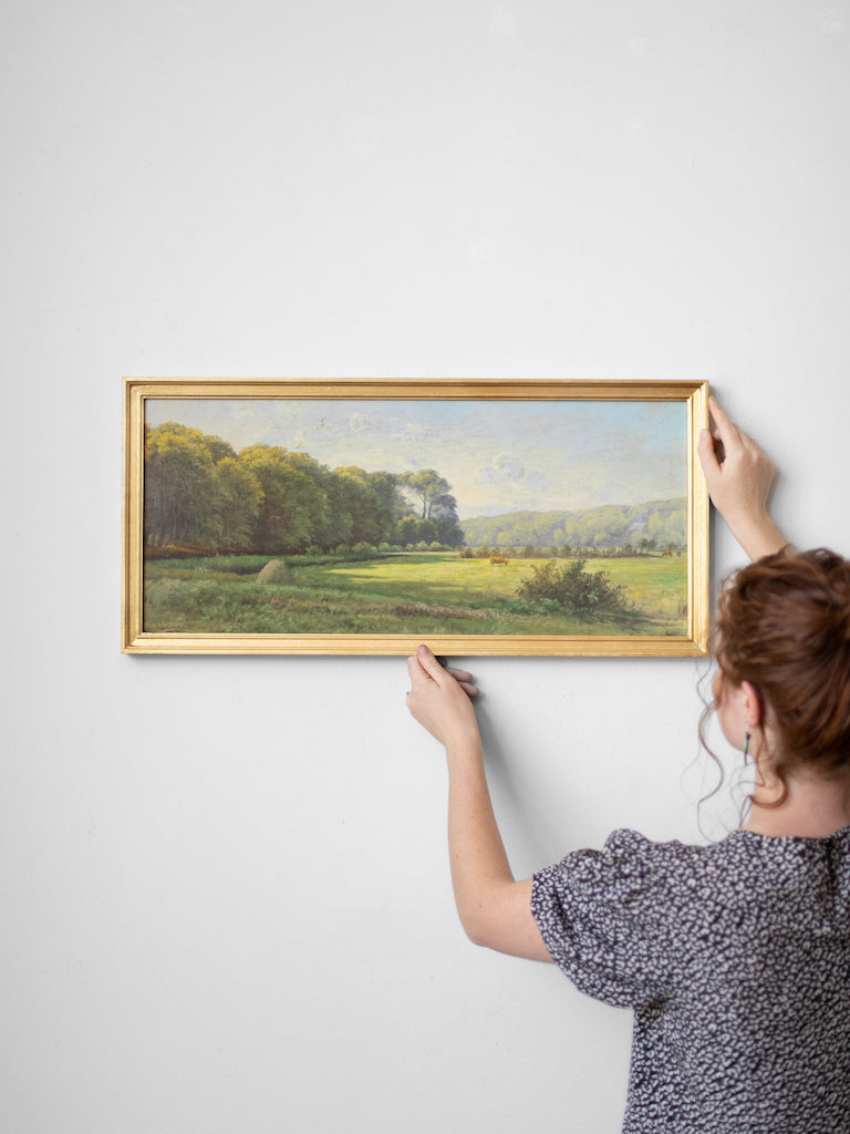 Person hanging Danish Pastoral up.
