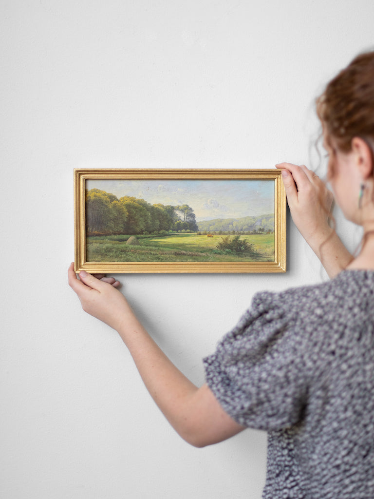 Close up of a person hanging up Danish Pastoral.