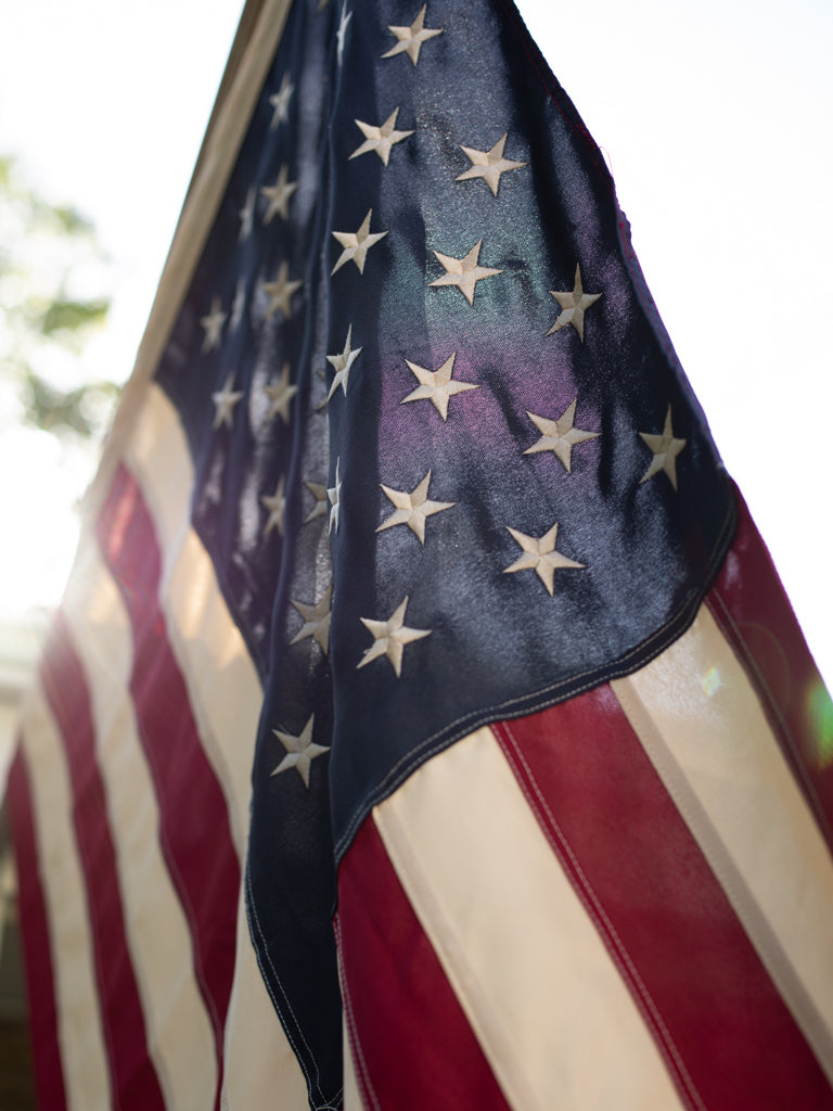 Close up of the Americana flag shimmering in the incoming light.
