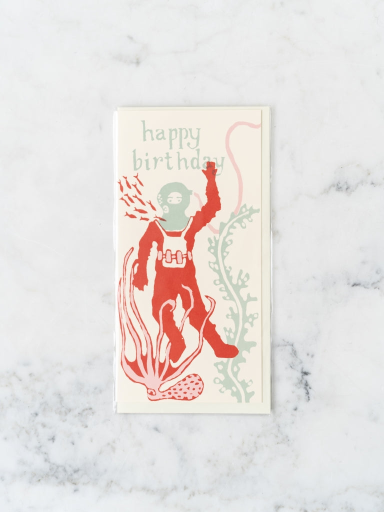 Red and blue deep sea diver underwater with ocean plants and animals happy birthday card.