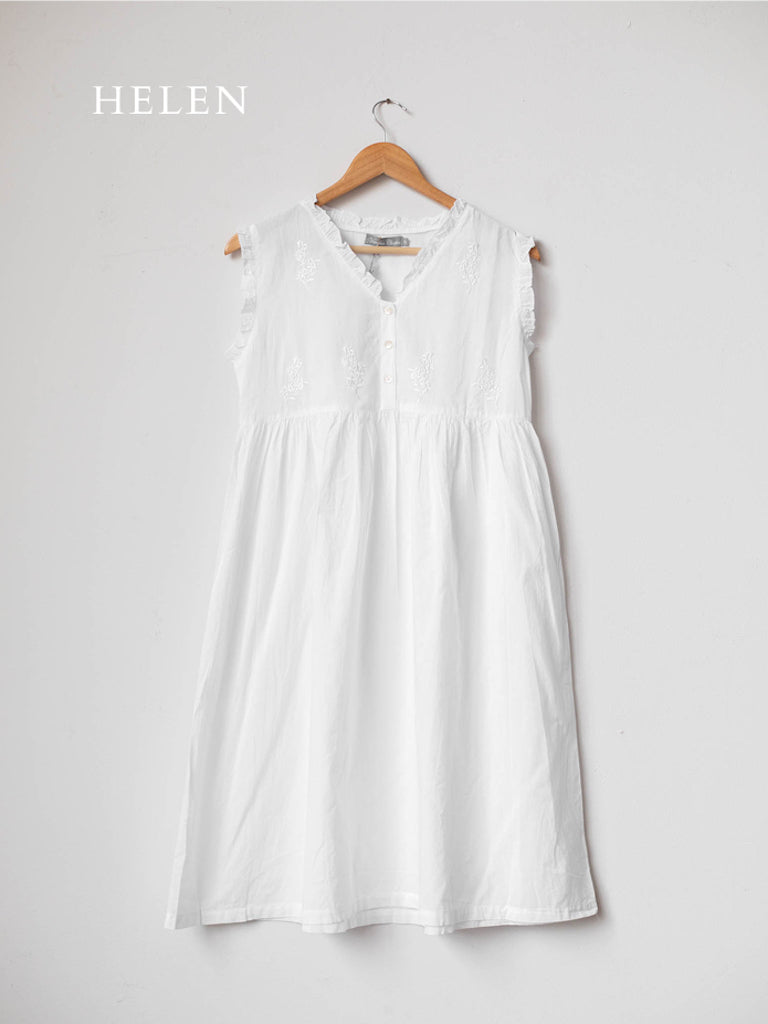 The white nightgown, short and sleeveless with a high waistline and simple details.