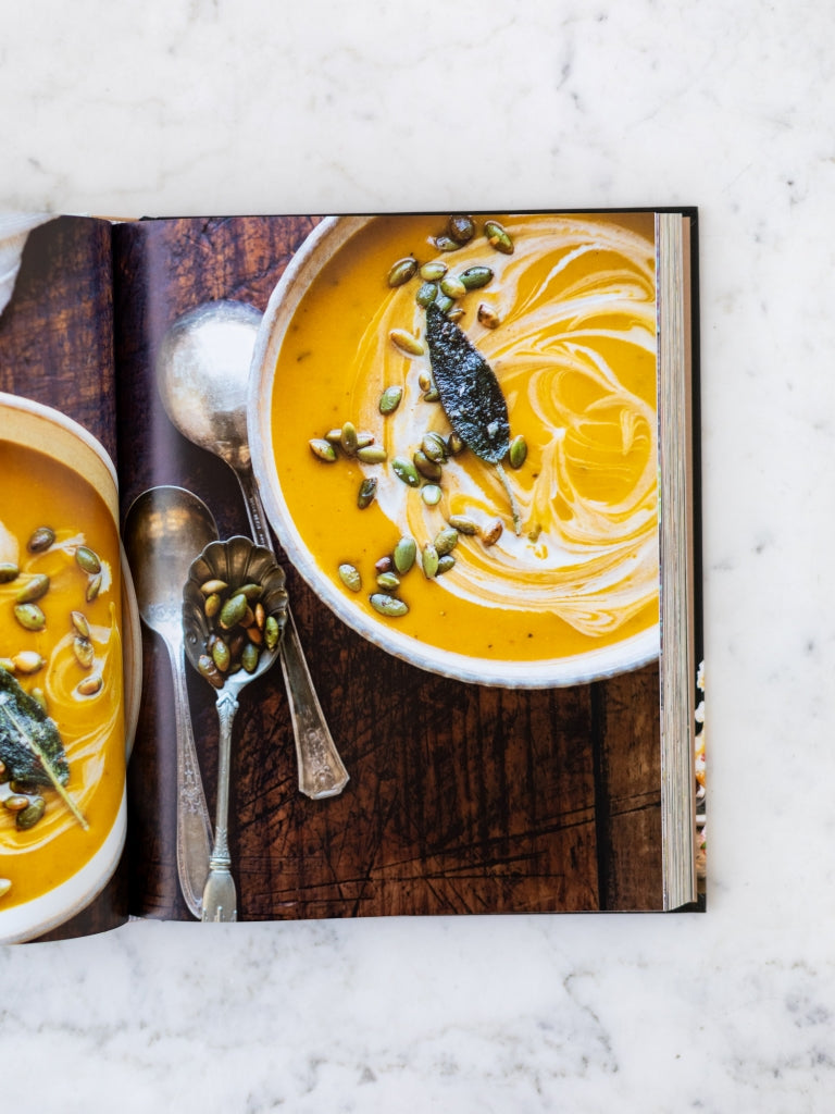 A page from the cookbook displaying a picture of a bowl of soup.