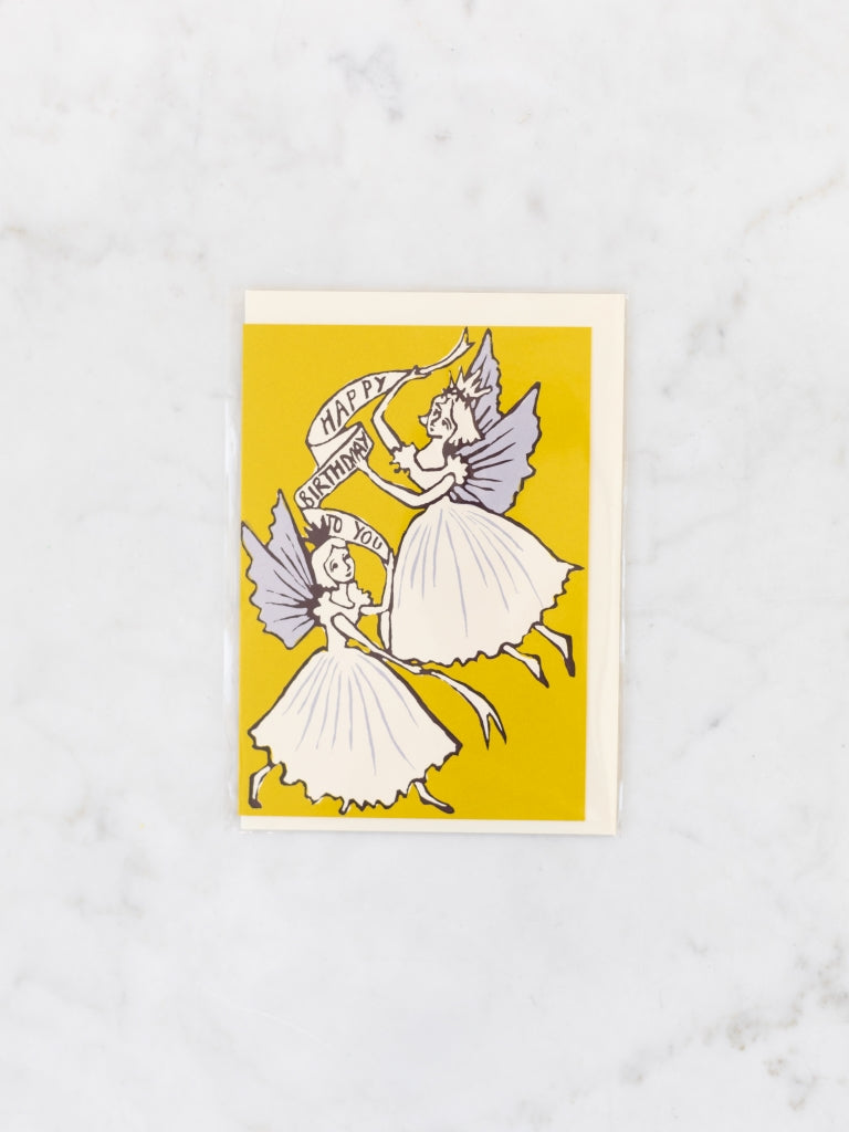 Yellow card with two white and purple fairies holding a banner happy birthday card.