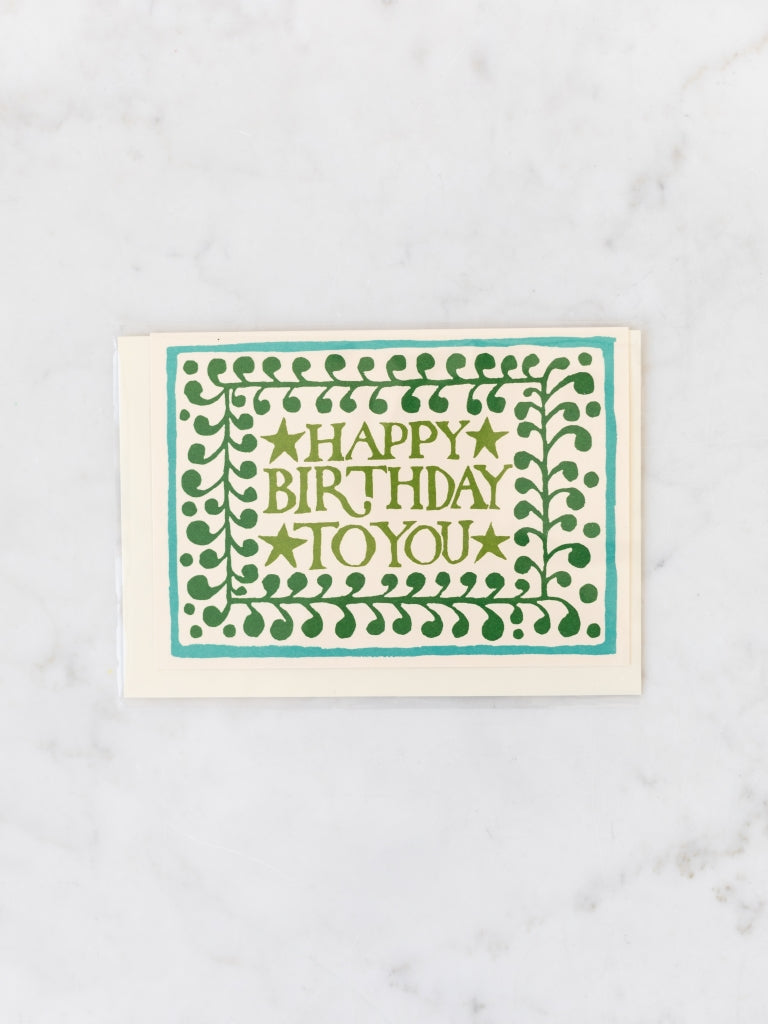Green and blue patterned happy birthday card.
