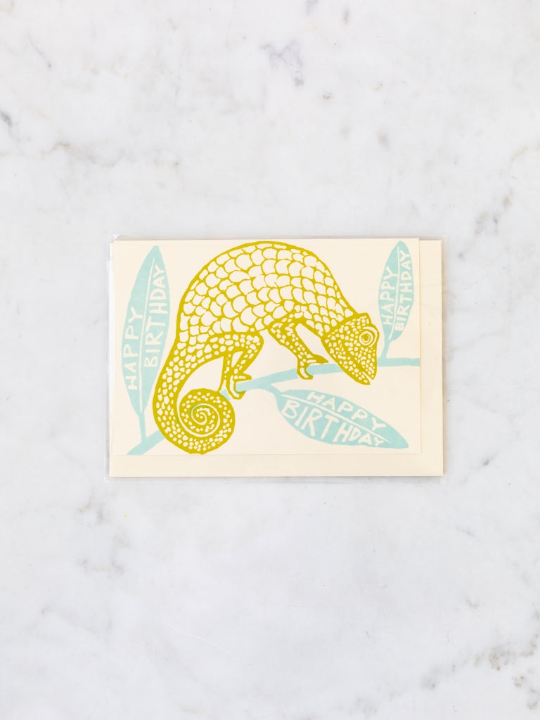 Green chameleon on a blue branch happy birthday card.