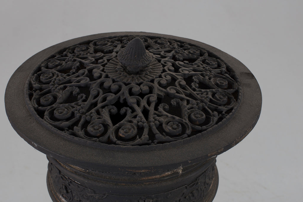 Black cast iron stove top cap