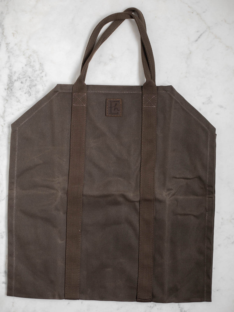 A picture of the entire canvas style dark brown log carrier bag.
