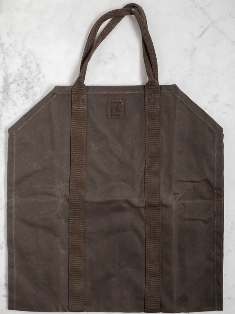 A picture of the entire canvas style dark brown log carrier bag.