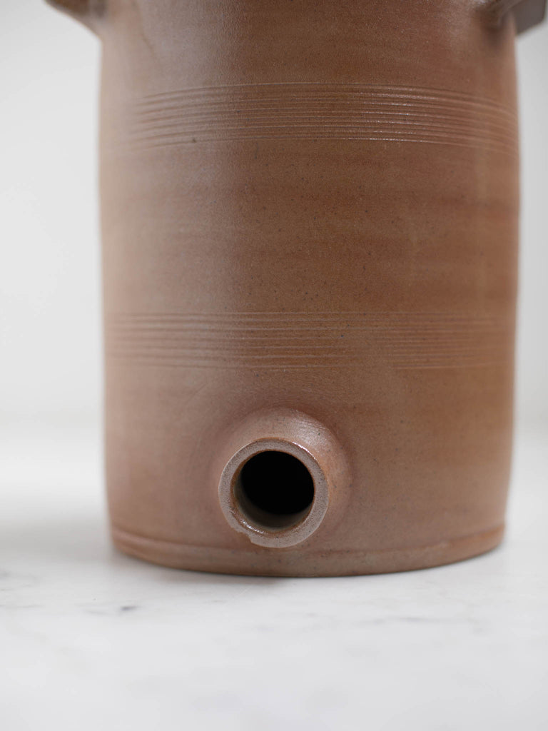 The hole where a spout goes on a water jug. 