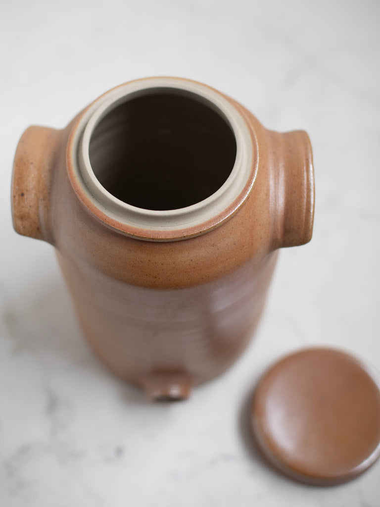 A water jug without its lid. 