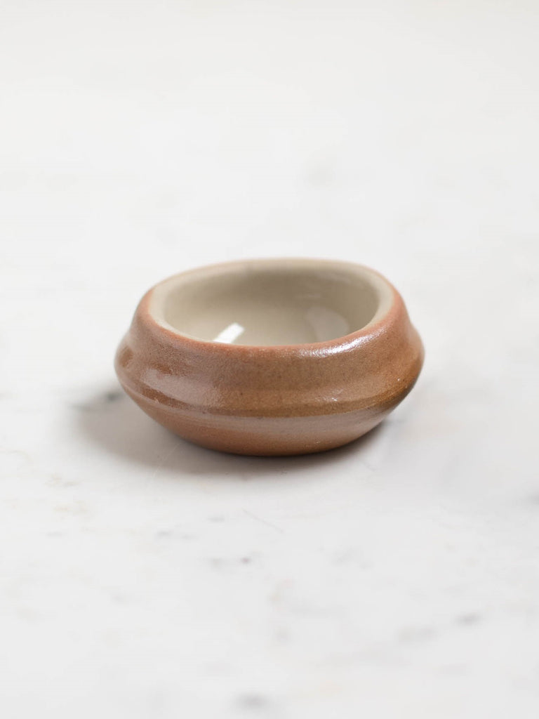 Light brown small wide dish. 