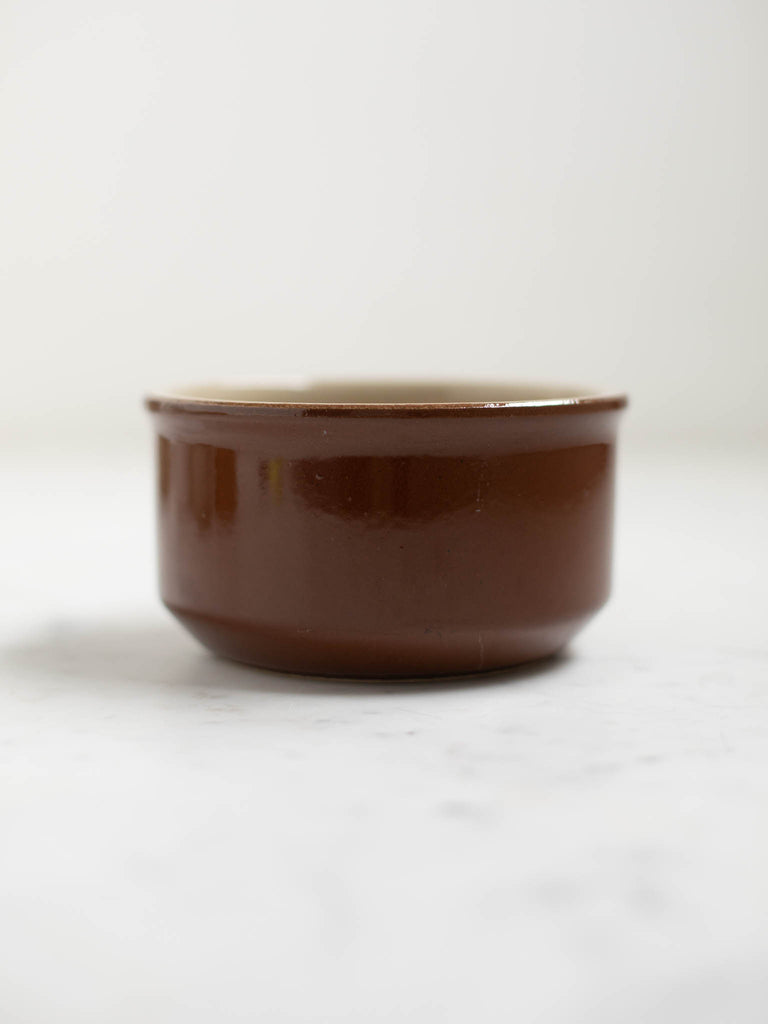 A small brown circle dish. 