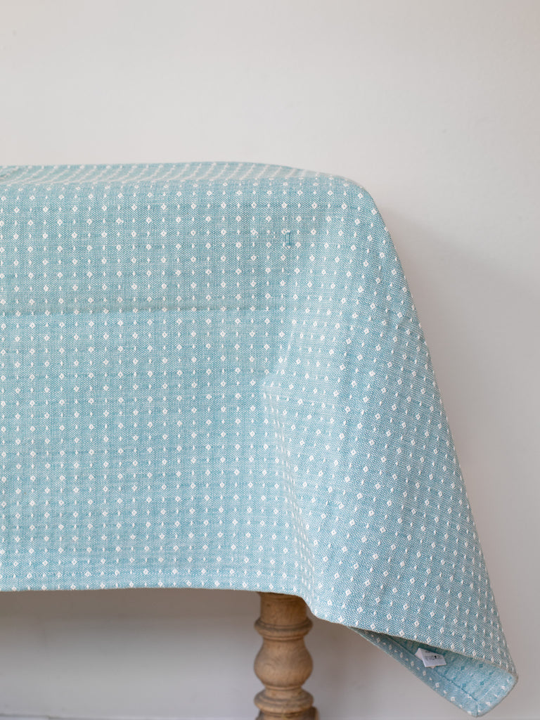 Side view of table cloth over a table.