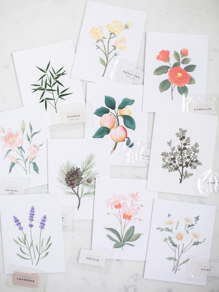A stack of all the greeting cards on a quartz countertop.