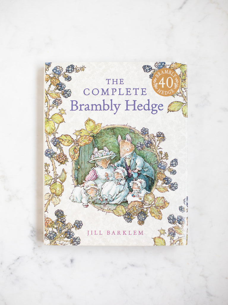 The Complete Brambly Hedge cover with a large character art in the middle and multiple blackberry bush branches.