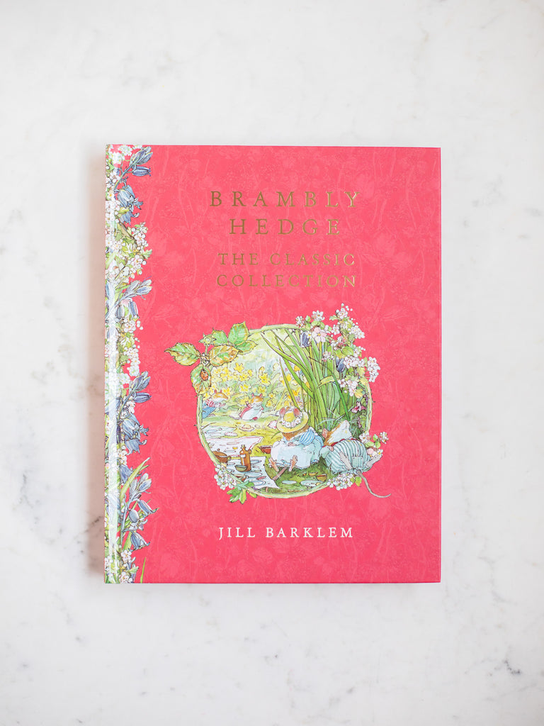 Brambly Hedge the Classic Collection book cover, red with wildflowers running up and down the spine and a large character art in the middle.