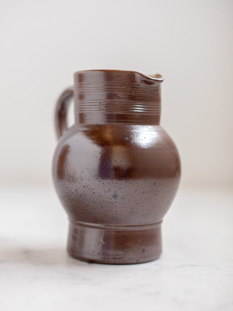 Dark brown pitcher. 