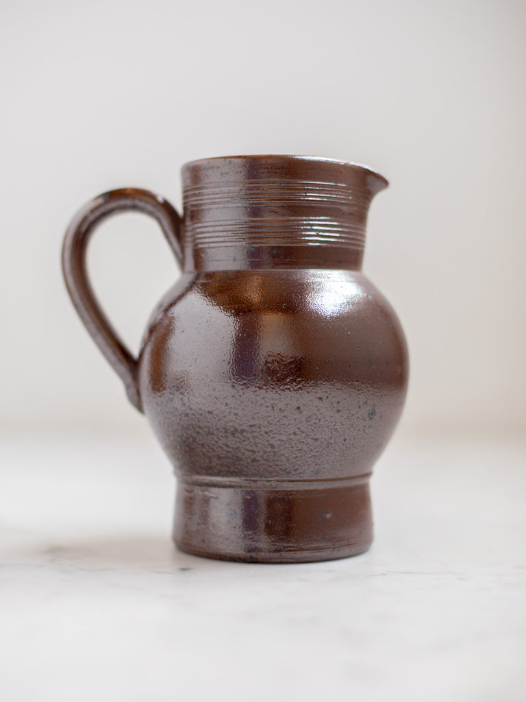 Dark brown pitcher.