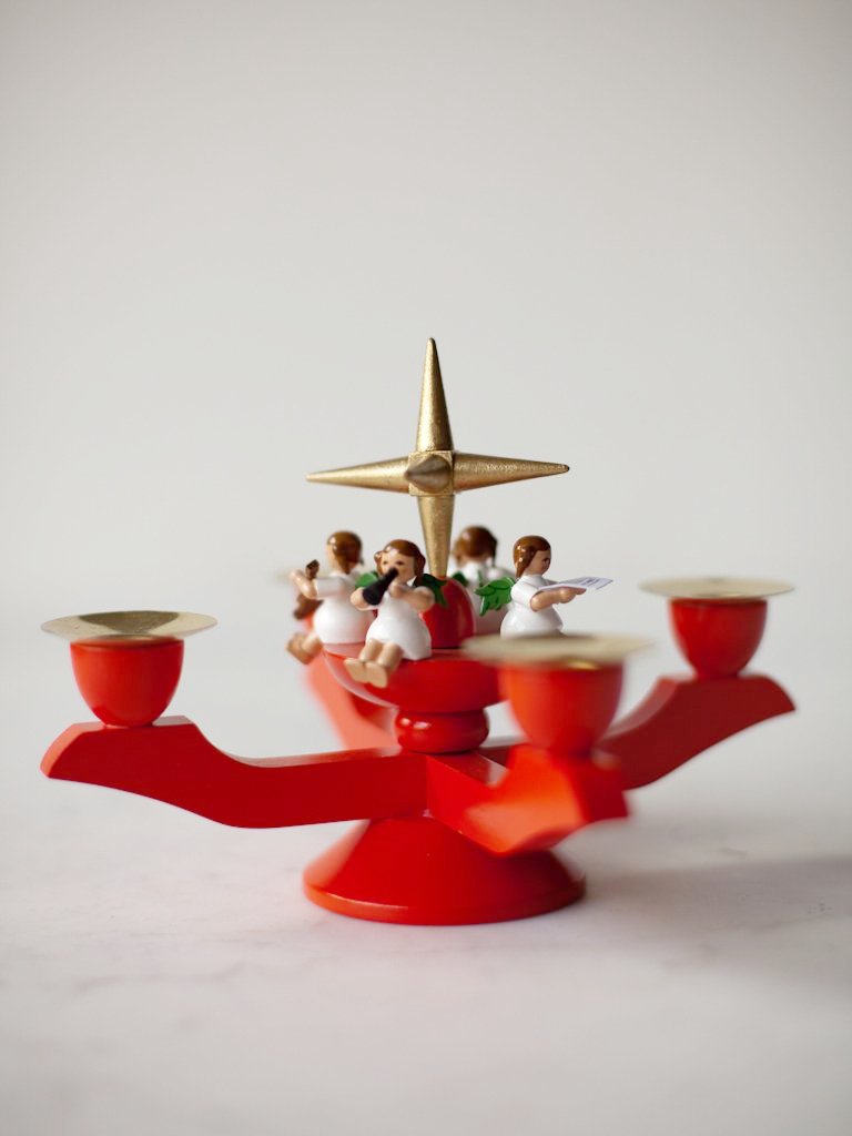 Side view of red candleholder.