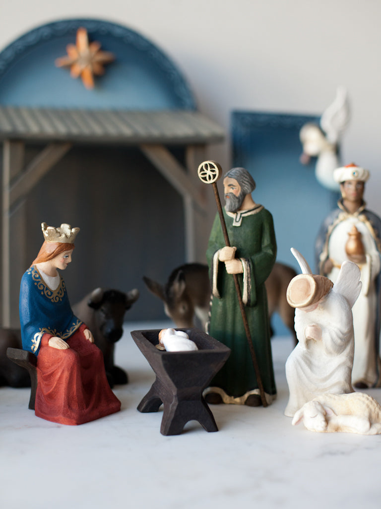 Mary, Joseph, and baby Jesus figurines accompanied by other characters.