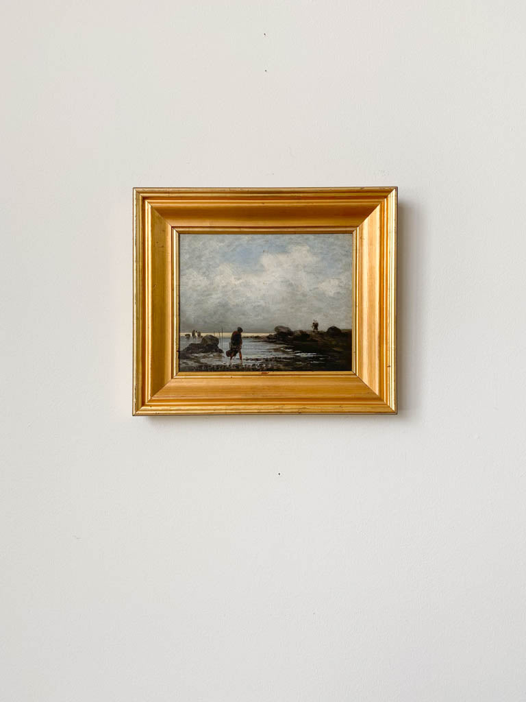 Original art piece with a thick gold-colored frame shot from afar.