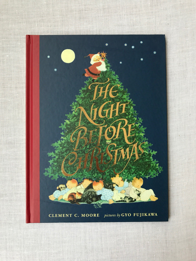 The Night Before Christmas Cover contains a drawing of a large Christmas tree with Santa sitting on the top and a pile of children all sleeping under the bottom.