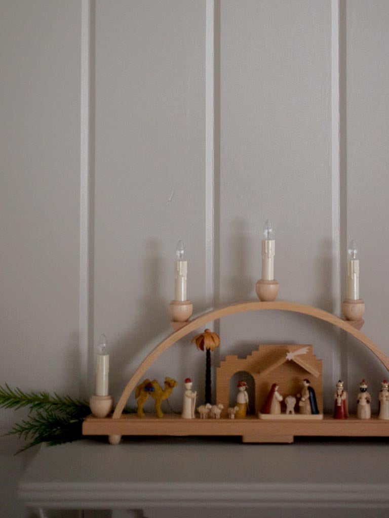 Far view of nativity in a dimmed light setting.