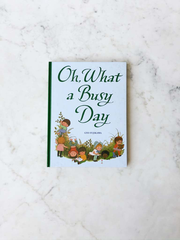 Oh What a Busy Day cover displaying multiple little children playing in different ways with each other.