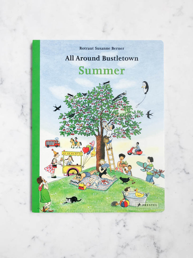 Bright cover with an illustration of a tree with cherries. Children play around the tree. The book is entitled “Summer”