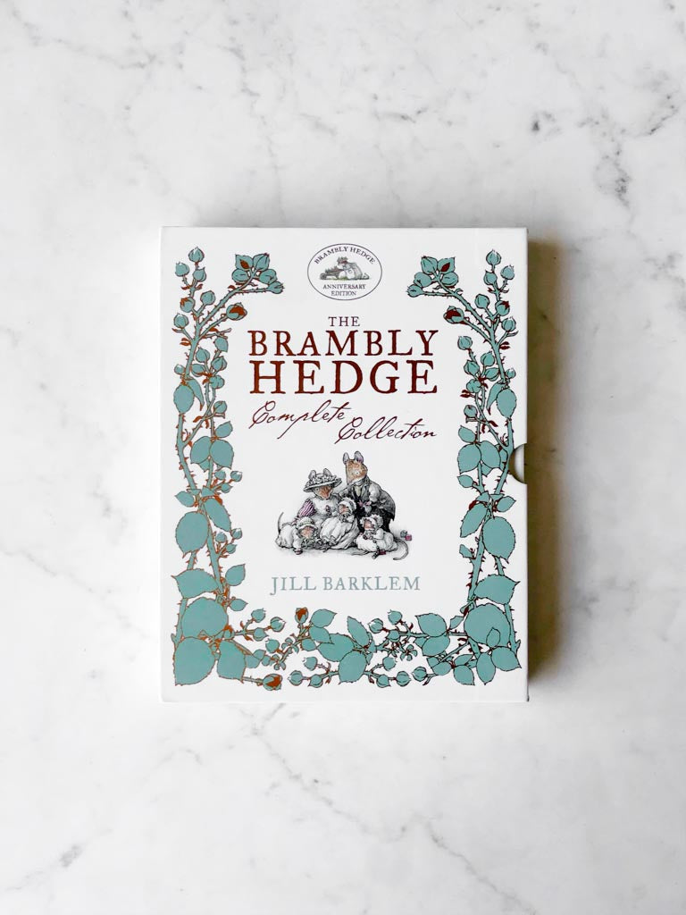 The Brambly Hedge Complete Collection book cover. Green leaves around the edges with a small piece of artwork in the middle.